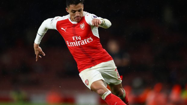 Keeping an eye on developments: Arsenal striker Alexis Sanchez.