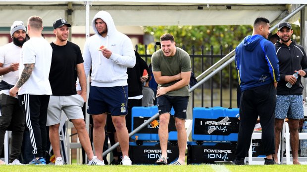 Tiger talk: Mitchell Moses shares a laugh with teammates on Monday.