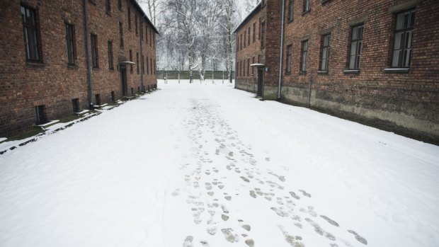 Footprints in the snow between the barracks of the former Auschwitz concentration camp.