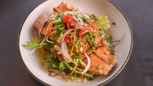 Insane fish is battered and fried barramundi, with a fragrant lemongrass sauce.