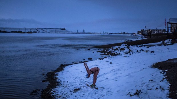 A woman exercises at the swimming club Walruses of Taimyr, where many take a dip in the icy waters of Lake Dolgoye, in Norilsk, Russia. 