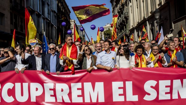 Xavier Garcia Albiol, leader of Popular Party of Catalonia, marches at a protest for Spanish unity in Barcelona.