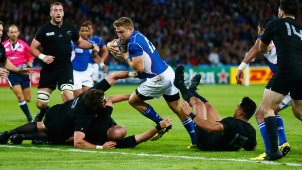 Battering ram: Johan Deysel leaves three All Blacks in his wake as he goes in to score.