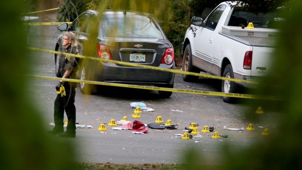 A forensic science investigator at the scene where  police officer Charles Kondek was shot.