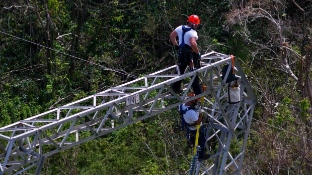 Whitefish Energy Holdings workers restore power lines damaged by Hurricane Maria in Barceloneta, Puerto Rico. 