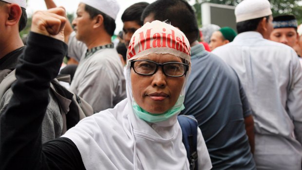 A protester outside Istiqlal Mosque in Jakarta on Friday afternoon.