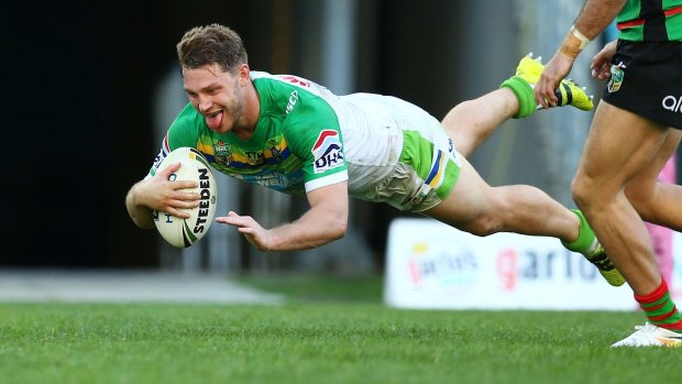 Green with envy: Elliot Whitehead scores his second try during the round 21 NRL match between the South Sydney Rabbitohs and the Canberra Raiders at ANZ Stadium.