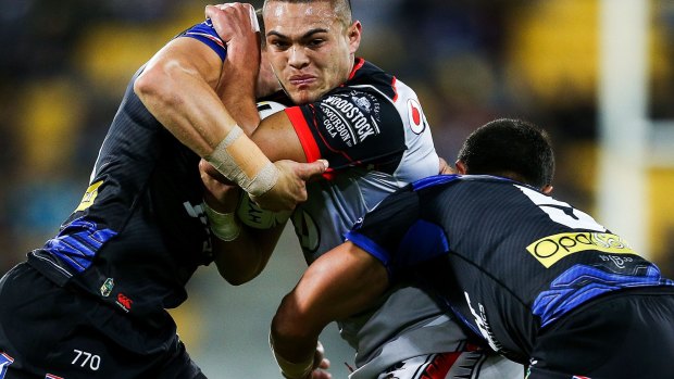 In a dogfight: Warrior Tuimoala Lolohea meets some opposition.
