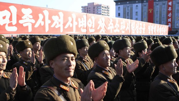 North Korean military personnel clap hands in a rally, after North Korea said it had conducted a hydrogen bomb test earlier this month.