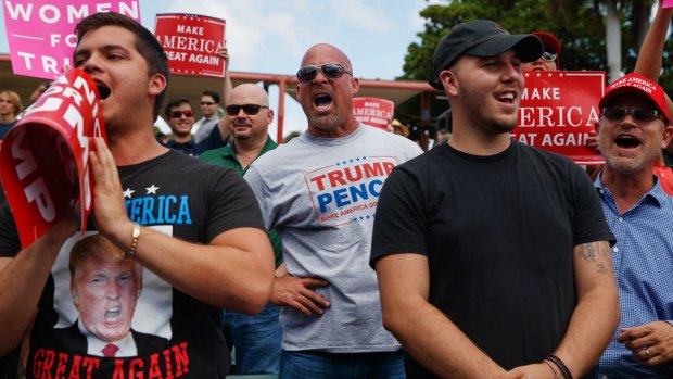 Supporters of Donald Trump yell at reporters during a campaign rally in Miami.