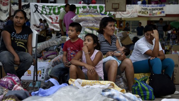 Relatives and friends of the students remain at the Ayotzinapa school.