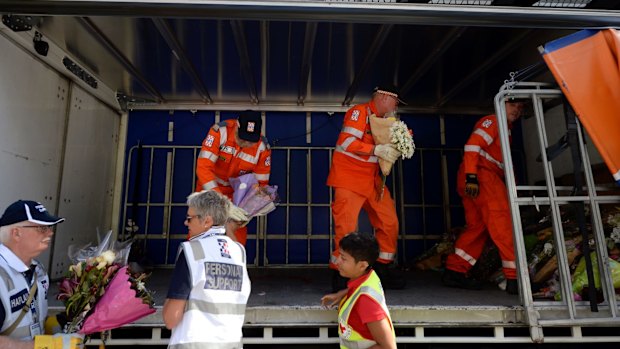 SES volunteers loaded the flowers onto a truck.