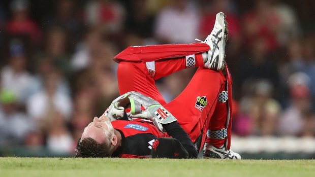 Night to forget: Peter Nevill lies on the ground after being struck in the head.
