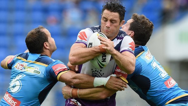 Too strong: Cooper Cronk crashes through for the Storm.