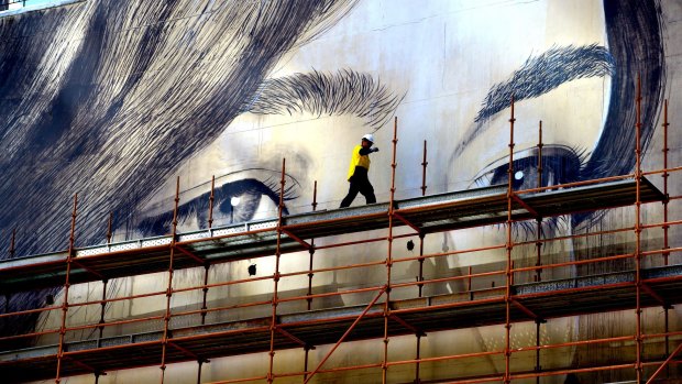 Scaffolding in front of Australia's biggest mural, painted by Rone in 2014.