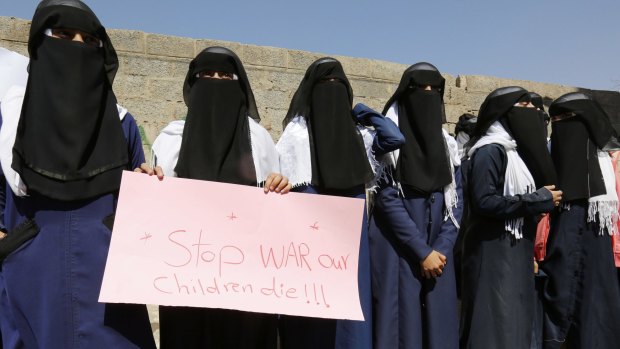Yemeni women hold a banner as they take part in a protest marking International Women's Day in front of the UN building in Sanaa, Yemen, on March 8.