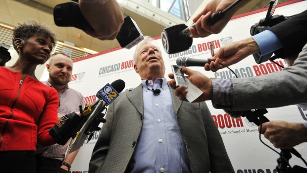 University of Chicago professor Richard Thaler talks with the media after winning the Nobel prize for economics.