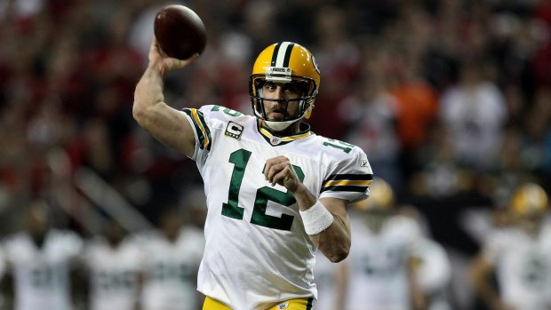 MVP: Aaron Rodgers passes to a receiver for the Green Bay Packers.