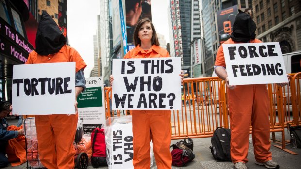 Protesters in New York demand the closure of the detention centre at the US naval base in Guantanamo Bay.