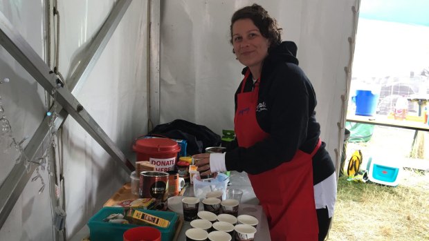 Salvation Army volunteer Kylie Smith making free coffee for people at Falls on Saturday.