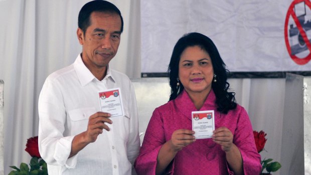 Indonesian President Joko Widodo and his wife Iriana cast their ballots. Ahok first became Jakarta's deputy governor on a ticket headed by Mr Joko.