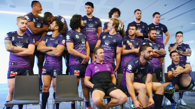 Storm coach Craig Bellamy and players wait for the team photographer at AAMI Park.