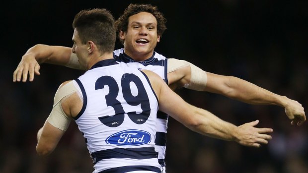 Shane Kersten of the Cats celebrates a goal with Steven Motlop during the match against Essendon.