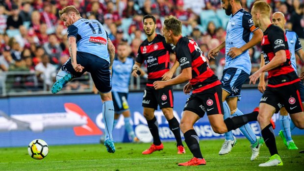 Tricky: David Carney backheels the ball on a night Sydney FC could do no wrong.