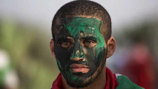 A Palestinain protester paints his face during clashes with Israeli solders during clashes at the Israeli border with Gaza last week. 