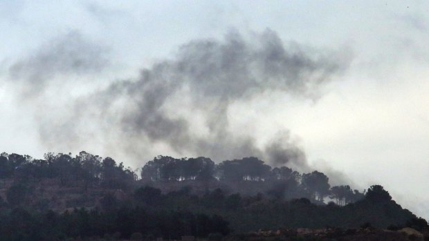 Smoke rises from inside Syria during shelling from Turkish forces. Turkey's operation is adding to the humanitarian crisis in Syria.