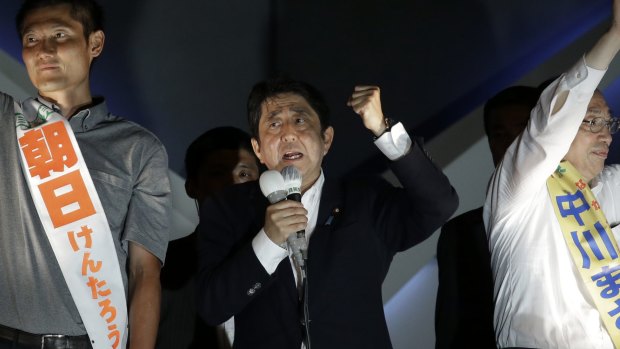Shinzo Abe, Japan's prime minister and president of the Liberal Democratic Party (LDP), centre, on Saturday.