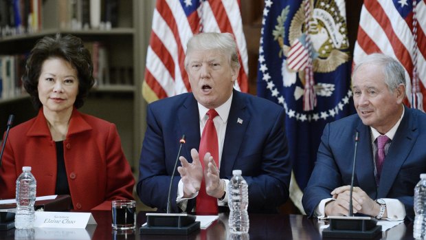 US President Donald Trump speaks while Elaine Chao, US secretary of transportation, left, and Stephen Schwarzman, CEO of Blackstone Group, listen during a strategic and policy discussion.