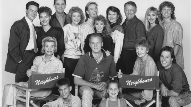 The cast of <i>Neighbours</i> in 1990, clockwise from left, Stefan Dennis, Fiona Corke, Paul Keane, Anne Charleston, Jason Donovan, Kylie Minogue, Lisa Armytage, Ian Smith, Annie Jones, Craig McLachlan, Guy Pearce, Vivean Gray, Sally Jensen, Alan Dale, Kristian Schmid and Anne Haddy