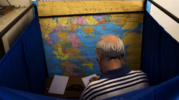 A man casts his vote on Sunday.