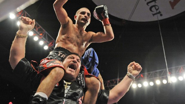 Sweet success: Vic Darchinyan celebrates his win against Jorge Arce, of Mexico, before the start of the last round of their IBC-WCB-WBA Super Flyweight Title fight in in Anaheim in 2009.  