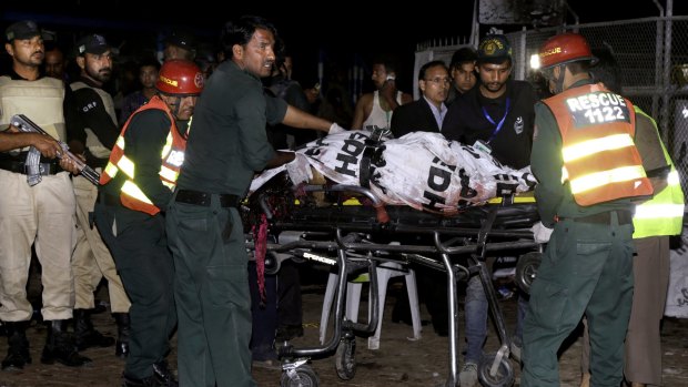 Rescue workers at the scene of the explosion near Gulshan-e-Iqbal Park in eastern Lahore.