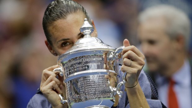 Surprise announcement: Flavia Pennetta retired soon after receiving the championship trophy.
