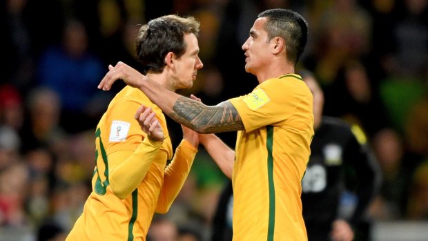 Robbie Kruse (left) comes on for Tim Cahill of the Socceroos during the 2018 FIFA World Cup Qualifier between Australia and Thailand at AAMI Park in Melbourne.
