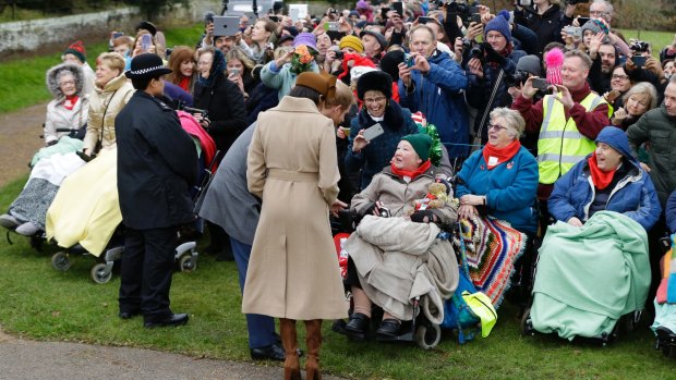 Meghan Markle and Prince Harry chat to well-wishers after the Christmas Day service at Sandringham.