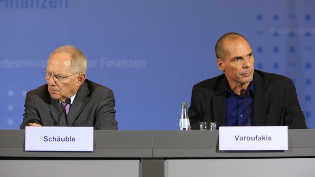 Awkward: Greece's finance minister Yanis Varoufakis, right, and Wolfgang Schaeuble.