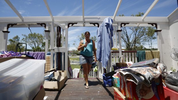 Yeppoon resident Demelza Bischoff inspects the damage to her home.