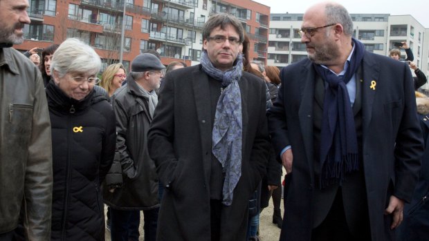Ousted Catalan leader Carles Puigdemont, center right, in Brussels.