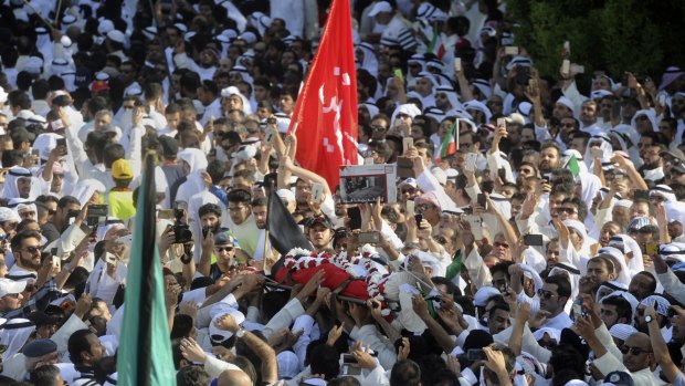 Kuwait's Islamic State troubles. Sunnis and Shiites took part in a mass funeral procession for 27 people killed in a suicide bombing that targeted the Shiite al-Sadiq mosque in June. 