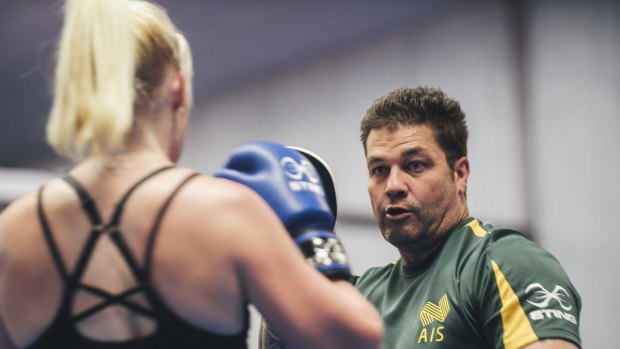 Mix 'n'match: Boxing Australia coach Paul Perkins has been working with Paralympic rower Kathryn Ross.