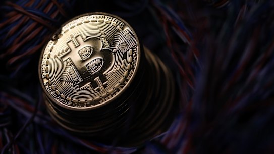 A stack of bitcoins sit among twisted copper wiring inside a communications room at an office in this arranged photograph in London, U.K., on Tuesday, Sept. 5, 2017. Bitcoin steadied after its biggest drop since June as investors and speculators reappraised the outlook for initial coin offerings. Photographer: Chris Ratcliffe/Bloomberg