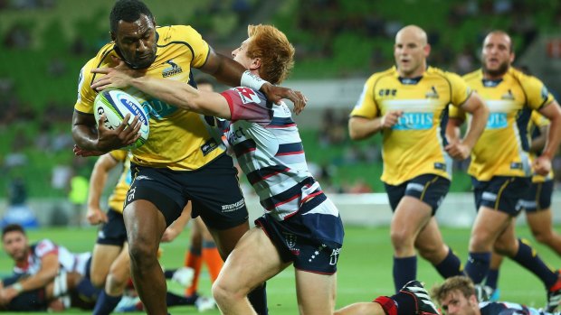  Tevita Kuridrani of the Brumbies breaks through a tackle by Nick Stirzaker of the Rebels to score.