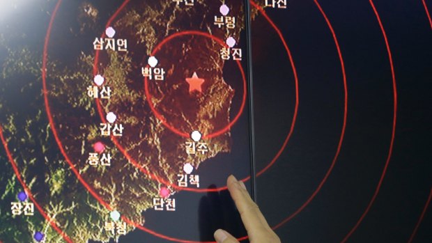 An official points at the epicentre of seismic waves in North Korea on Friday.