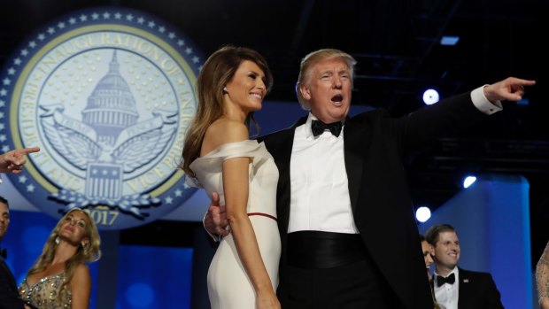 President Donald Trump acknowledges the crowd with first lady Melania Trump at the Freedom Ball. 