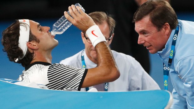 Roger Federer receives treatment during the Australian Open final against Rafa Nadal.