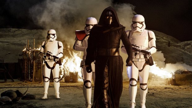 A scene from <i>Star Wars: The Force Awakens</i> featuring Kylo Ren (Adam Driver) with stormtroopers.